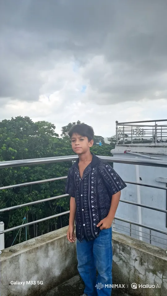 Young Boy on Balcony Amidst Overcast Day – AI Generated Video | Hailuo AI