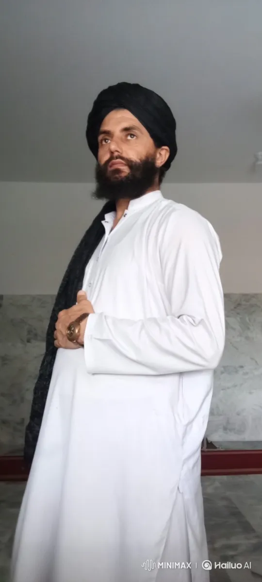 Contemplative Man in White Tunic with Black Sash – AI Generated Video | Hailuo AI