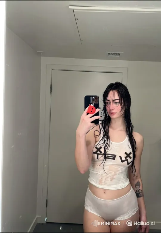 Young Woman Taking Selfie in Brightly Lit Mirror – AI Generated Video | Hailuo AI