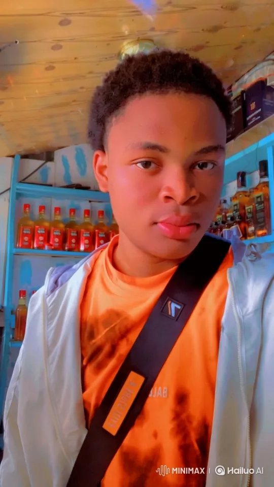 Young Man in Shop with Steady Gaze as Camera Moves Up – AI Generated Video | Hailuo AI