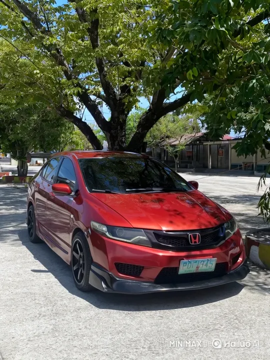 Cinematic Lowering of Metallic Red Sedan with Custom Wheels – AI Generated Video | Hailuo AI