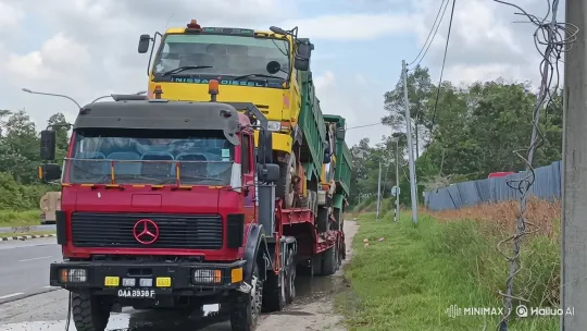 Red Truck Carrying Yellow Dump Truck on Flatbed Trailer – AI Generated Video | Hailuo AI