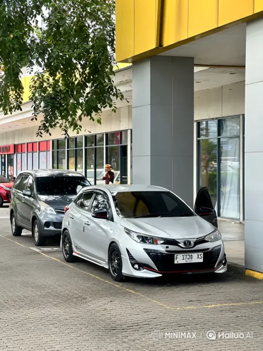 Silver Hatchback Lowers on Paved Lot – AI Generated Video | Hailuo AI
