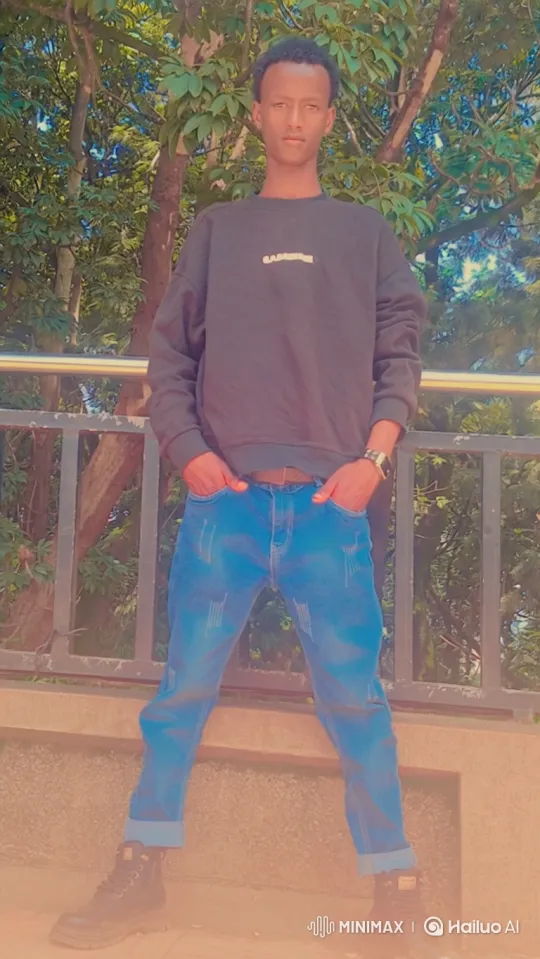 Young Man Stands Confidently in Outdoor Scene – AI Generated Video | Hailuo AI