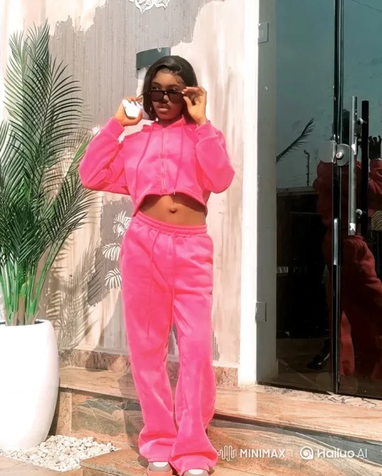 Young Woman in Pink Tracksuit Enters Sleek Pink Car – AI Generated Video | Hailuo AI