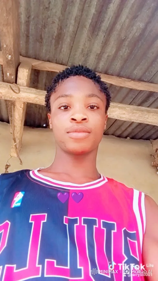 Young Person in Dual-Colored Jersey Holds Gaze – AI Generated Video | Hailuo AI