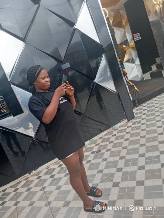 Young Woman Smiles While Using Smartphone on Patio – AI Generated Video | Hailuo AI