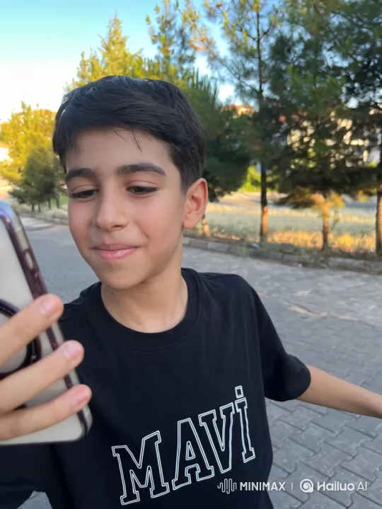 Young Boy Answers Call with Joyful Smile – AI Generated Video | Hailuo AI