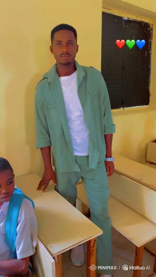 Young Man in Classroom with Gentle Smile – AI Generated Video | Hailuo AI