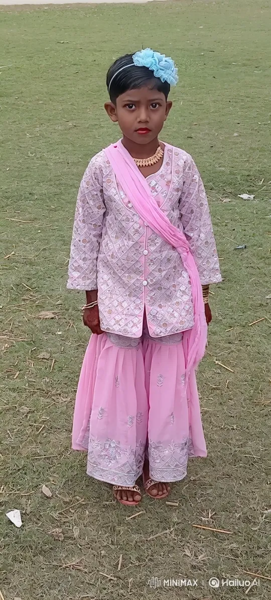 Young Girl in Embroidered Outfit Poses in Field – AI Generated Video | Hailuo AI