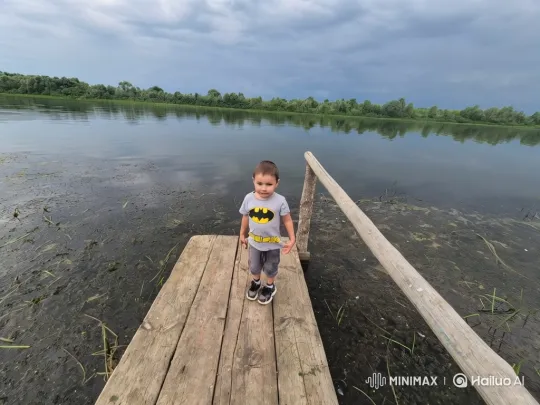 Young Boy in Batman Shirt Jumps into Lake – AI Generated Video | Hailuo AI
