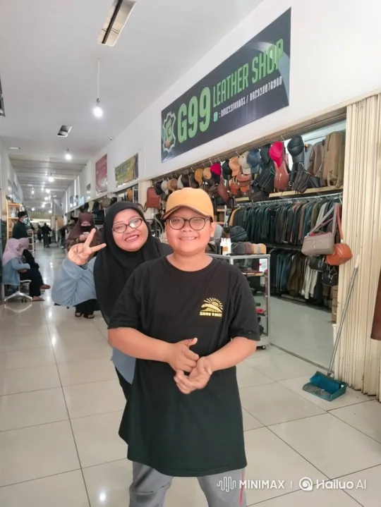 Woman and Boy Pose, Then Interact in Leather Store – AI Generated Video | Hailuo AI