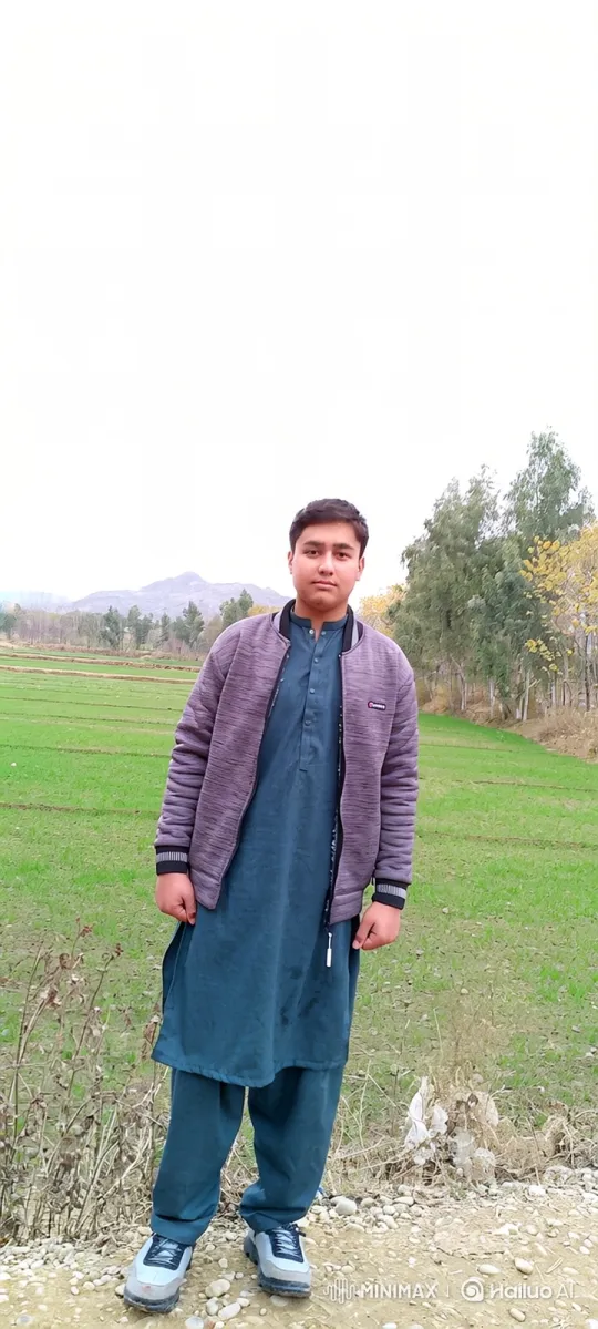 Young Man Stands Still Amidst Rural Breeze – AI Generated Video | Hailuo AI