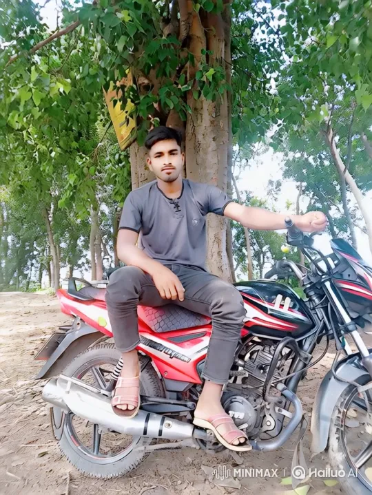 Young Man on Motorcycle Amidst Wooded Serenity – AI Generated Video | Hailuo AI