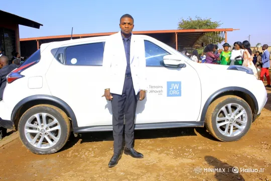 African Man in White Blazer in JW Vehicle Setting – AI Generated Video | Hailuo AI