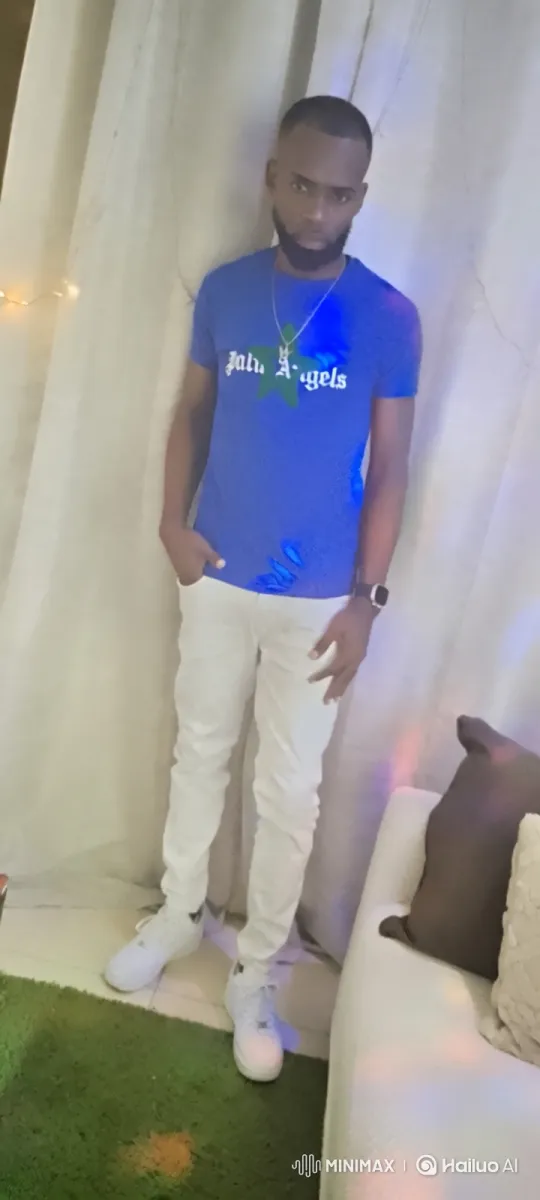 Man in Blue Shirt Stands Still During Smooth Camera Tracking Shot – AI Generated Video | Hailuo AI