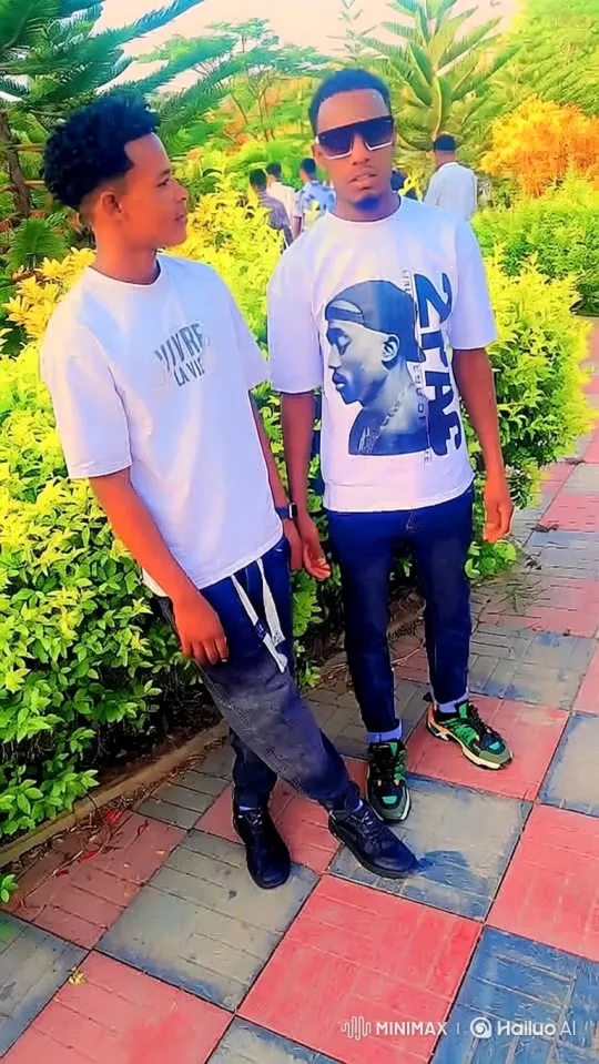 Young Men Pose and Smile in Park Setting – AI Generated Video | Hailuo AI