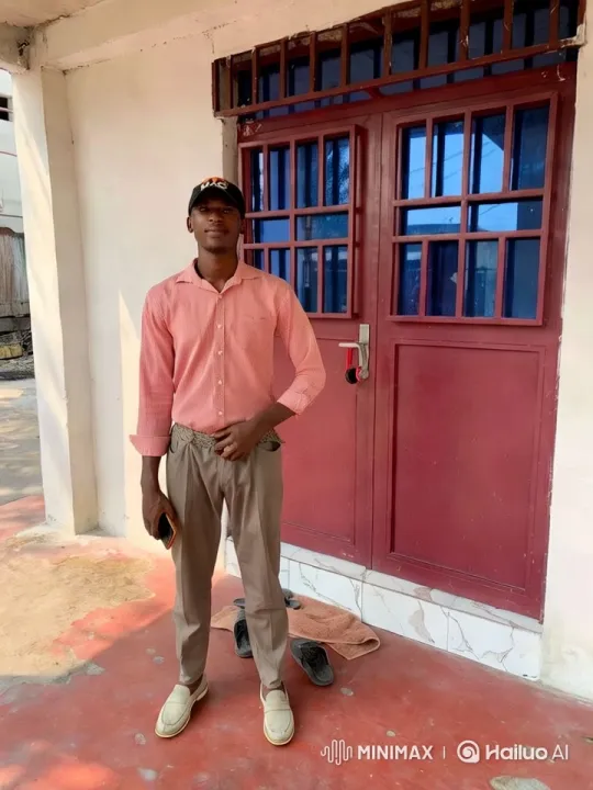 Confident Young Man in Front of Red Door – AI Generated Video | Hailuo AI