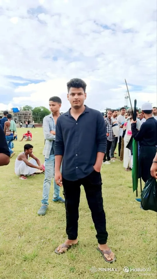Young Man in Field with Calm Gaze Amidst Soft Breeze – AI Generated Video | Hailuo AI