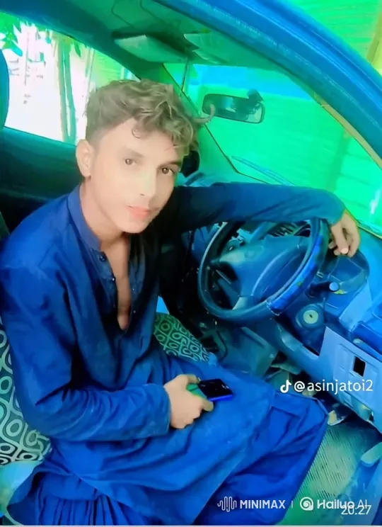 Young Man in Car with Smartphone, Captivating Greenish-Blue Light – AI Generated Video | Hailuo AI