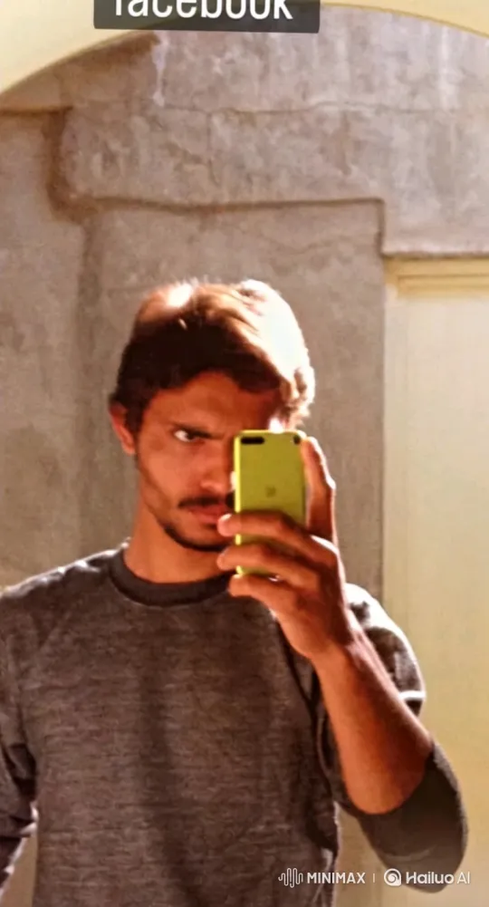 Young Man Deep in Concentration While Taking a Selfie – AI Generated Video | Hailuo AI