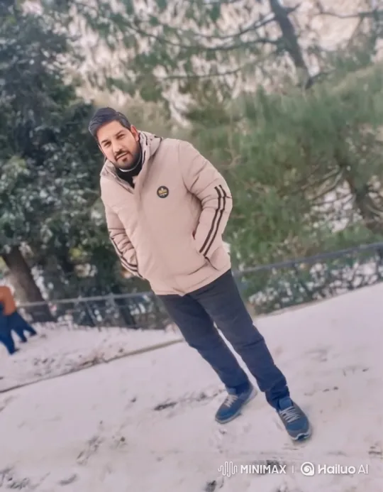 Winter Serenity: Man Smiles Amidst Falling Snow – AI Generated Video | Hailuo AI