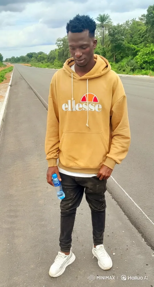 Young Man Walks Along Deserted Road with Changing Camera Angles – AI Generated Video | Hailuo AI