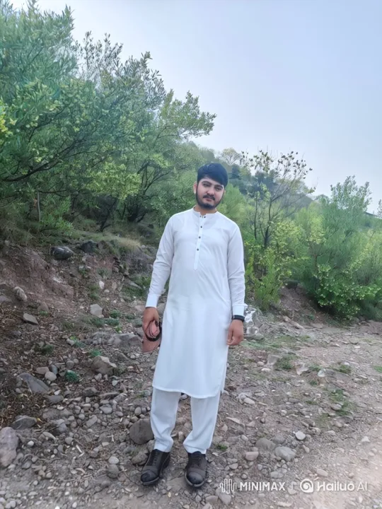 Young Man Walks on Hillside in Serene Landscape – AI Generated Video | Hailuo AI
