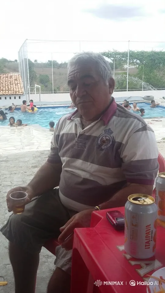 Contemplative Older Man by the Pool Sips Drink – AI Generated Video | Hailuo AI