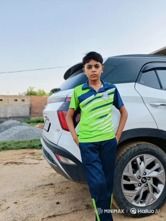 Young Boy Poses by Luxury Car in Rustic Setting – AI Generated Video | Hailuo AI