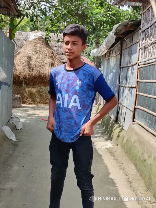 Boy Stands Thoughtfully in Rural Village Pathway – AI Generated Video | Hailuo AI