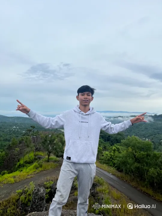 Man Embraces Earth from Majestic Mountain Peak – AI Generated Video | Hailuo AI