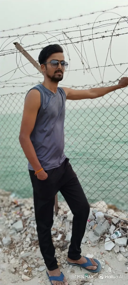 Young Man Watches Car Approach by Fence Near Water – AI Generated Video | Hailuo AI