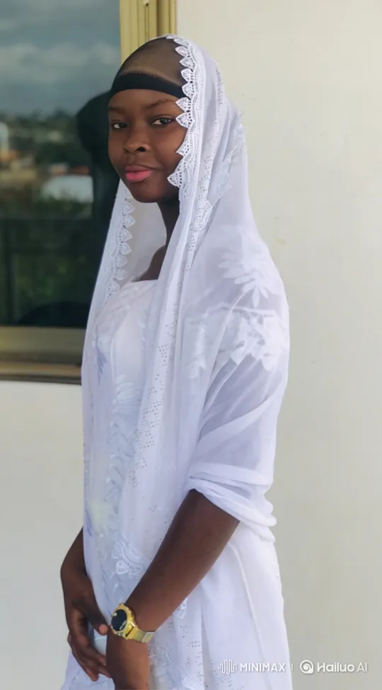 Young Black Woman in White Clothing with Gentle Expression – AI Generated Video | Hailuo AI