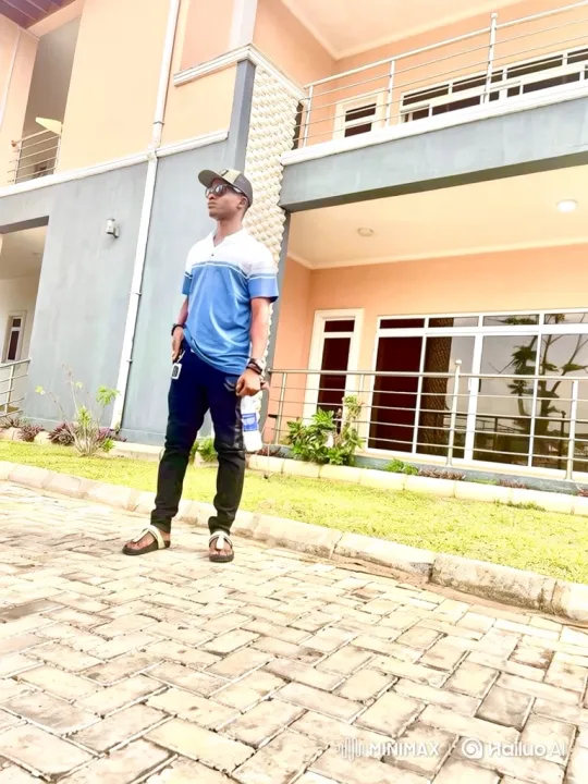 Man in Casual Attire Turns to Camera on Herringbone Driveway – AI Generated Video | Hailuo AI