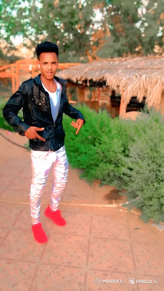 Young Man Poses confidently on an outdoor terrace, a silver jet flies past him. – AI Generated Video | Hailuo AI