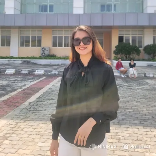 Young Woman in Modern Plaza: Graceful Walk Tracking Shot – AI Generated Video | Hailuo AI