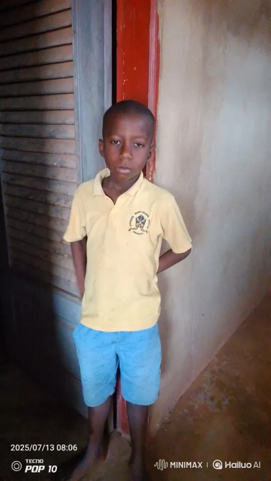 Boy in Yellow Shirt Stands Still Amidst Moving Camera – AI Generated Video | Hailuo AI