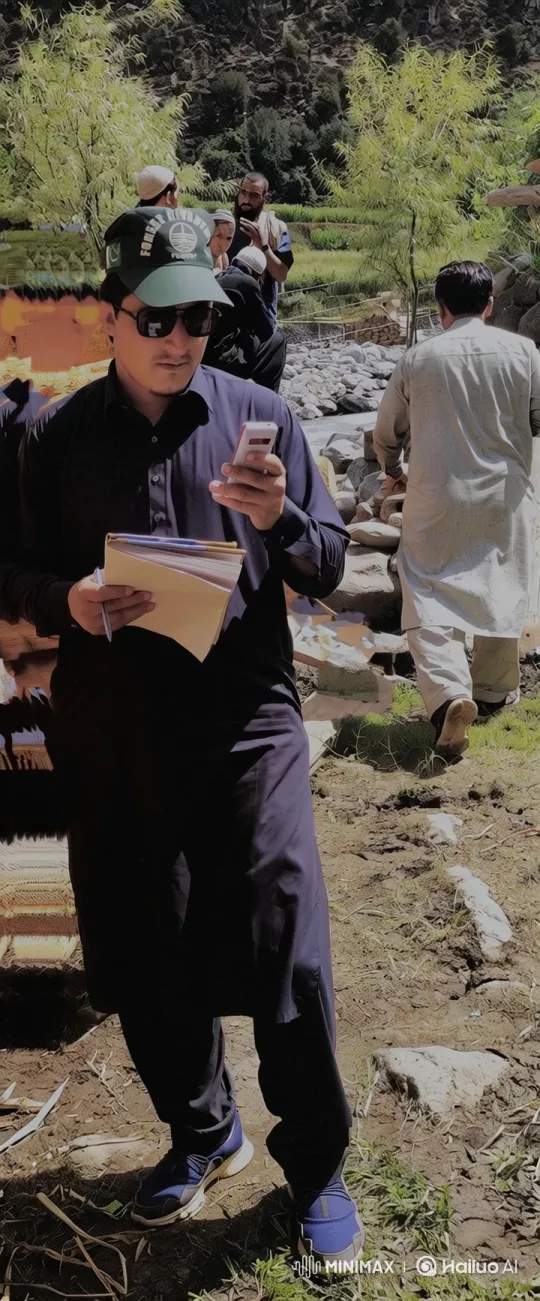 Man Swiping Phone on Dirt Path Amidst Rocky Hillside – AI Generated Video | Hailuo AI