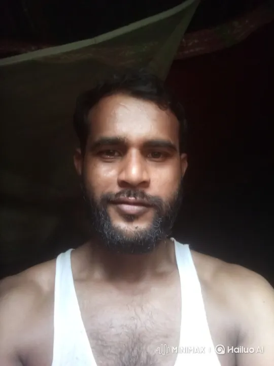 Man with Intense Gaze in Dimly Lit Frame – AI Generated Video | Hailuo AI