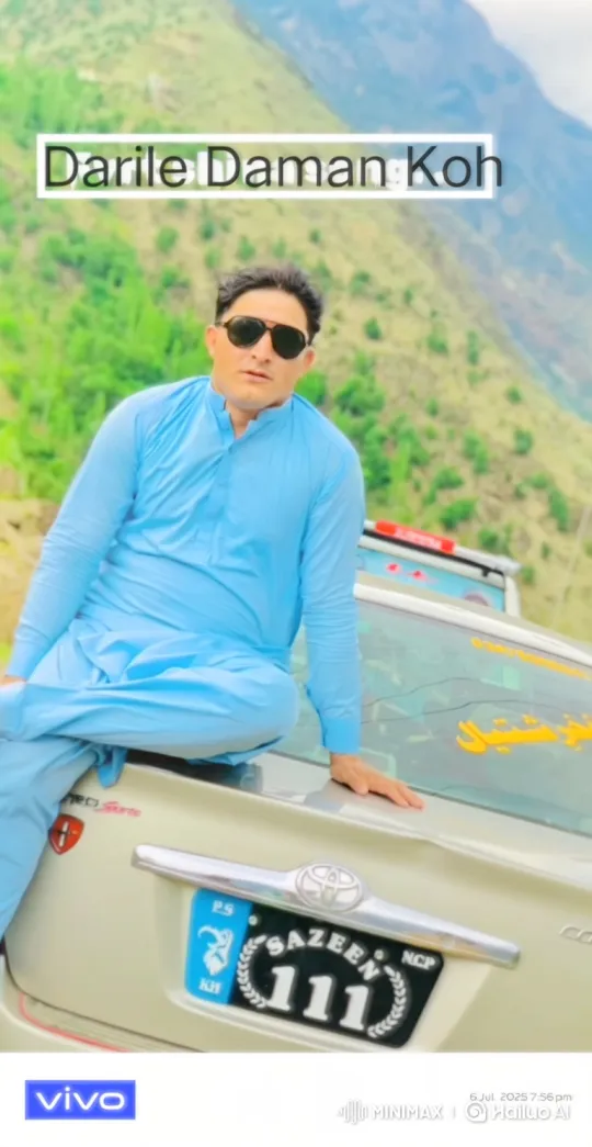 Man Relaxing on Car Amidst Mountain Panorama – AI Generated Video | Hailuo AI