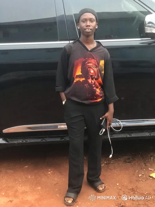 Young Person Smiling by Black Vehicle – AI Generated Video | Hailuo AI