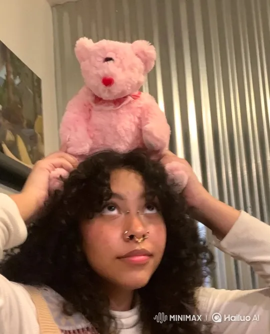 Young Woman Greetings with Teddy Bear on Head – AI Generated Video | Hailuo AI