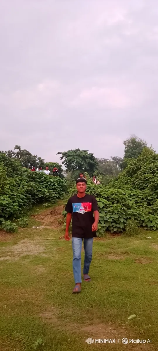 Young Man Walking Towards Camera in Park Setting – AI Generated Video | Hailuo AI