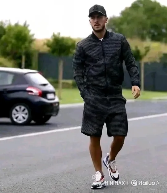 Man in Dark Patterned Outfit Walks on Road – AI Generated Video | Hailuo AI