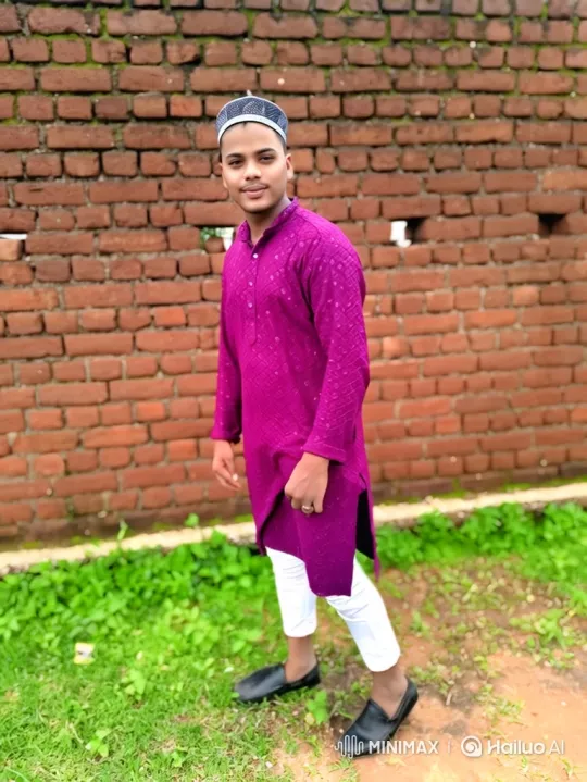 Young Man in Magenta Tunic with Gentle Smile – AI Generated Video | Hailuo AI