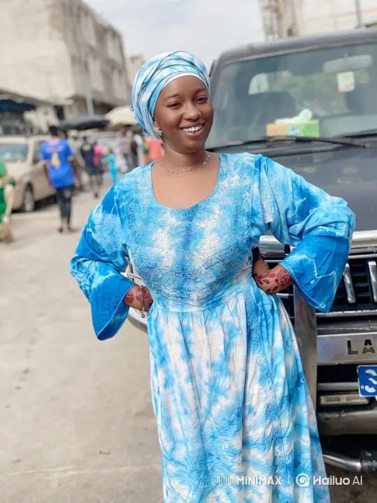 Joyful Woman in Tie-Dye Dress on Bustling Street – AI Generated Video | Hailuo AI