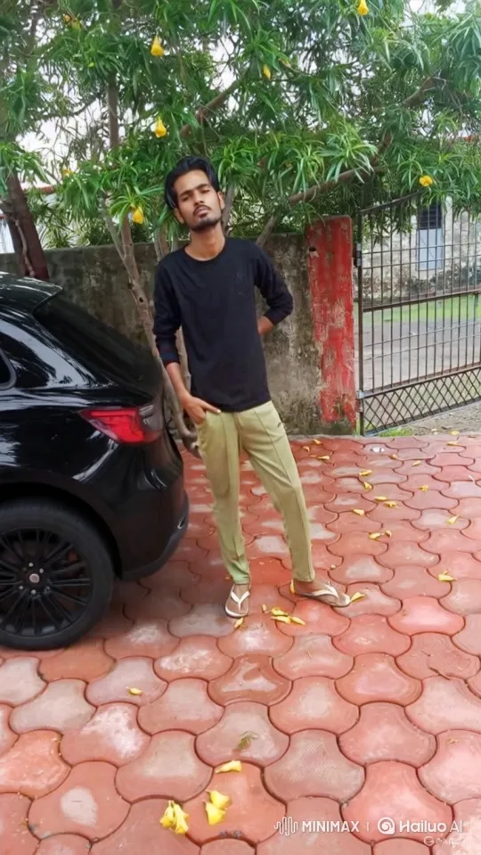 Young Man Poses in Driveway with Tree and Car – AI Generated Video | Hailuo AI