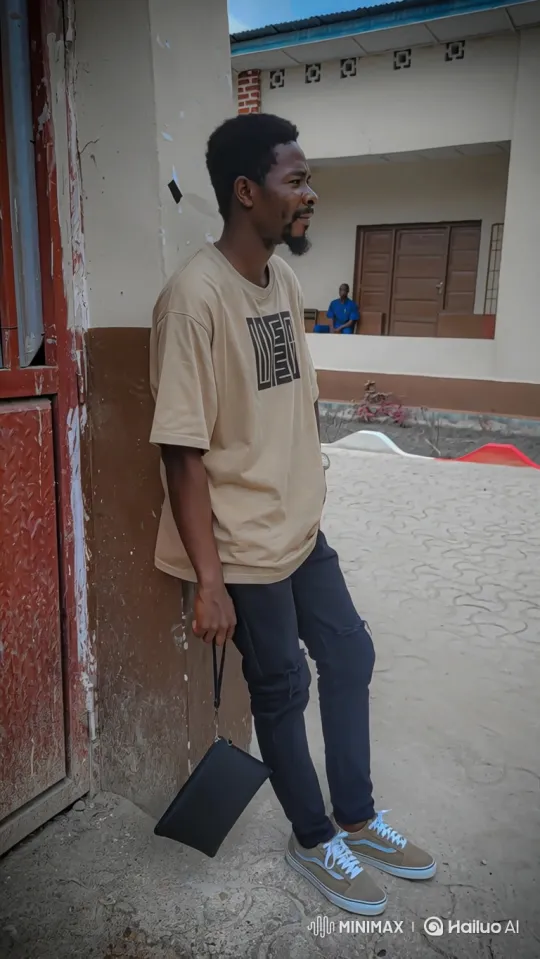 Young Man in Thoughtful Pose in Outdoor Courtyard – AI Generated Video | Hailuo AI