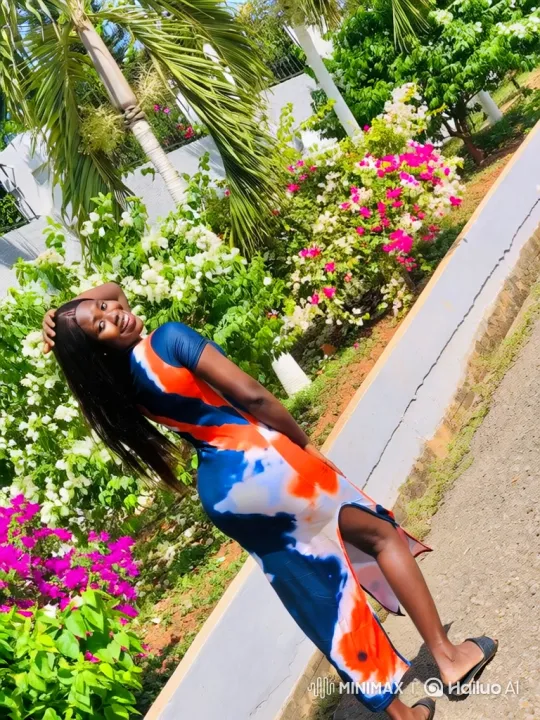 Young Woman Poses and Walks in Garden in Vibrant Tie-Dye Dress – AI Generated Video | Hailuo AI